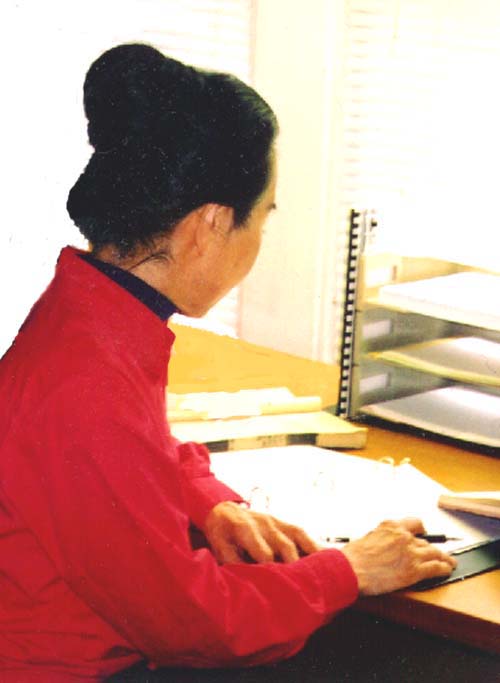 Taeko at Her Desk